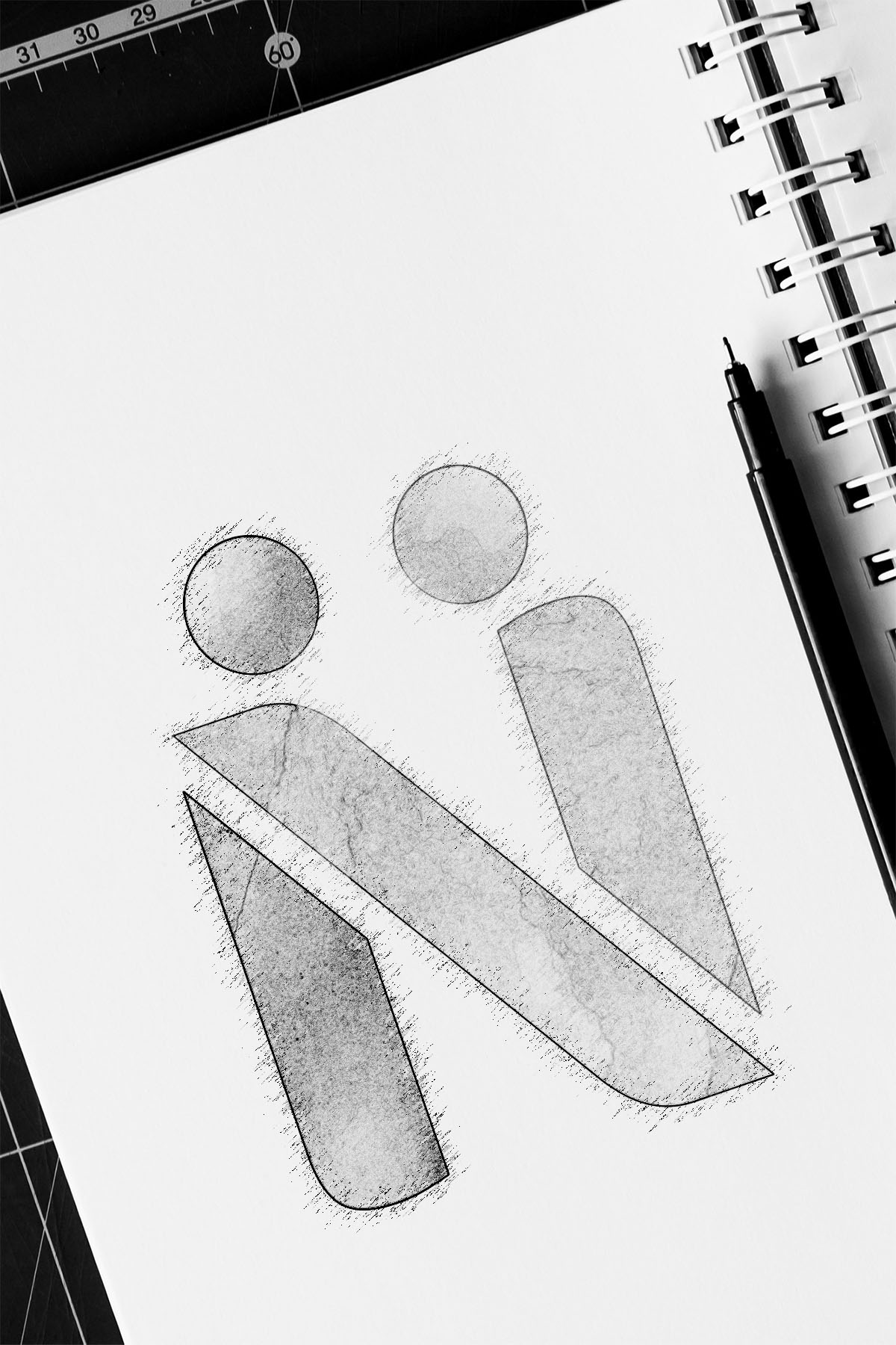 Eine schwarz-weiß Zeichnung des Logos in einem Notizblock 